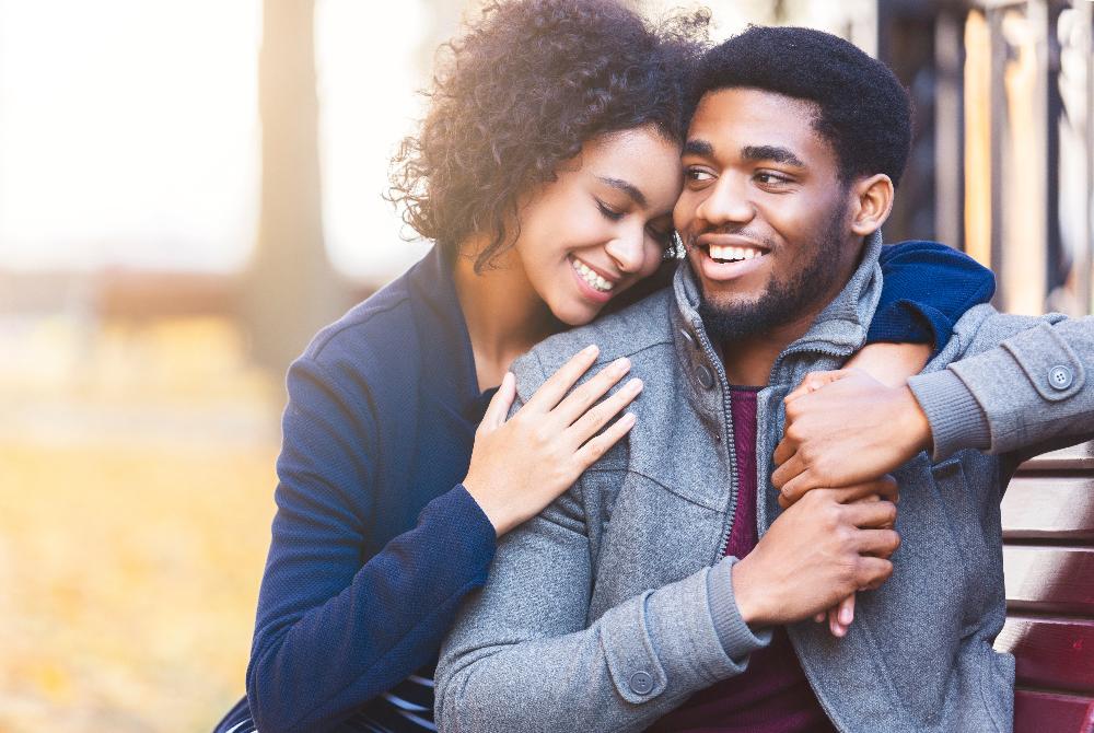 young couple hugging | dentist bloomington indiana