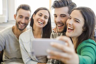 group of four smiling | dentist in bloomington in