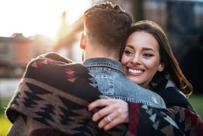 young couple hugging l invisalign in bloomington indiana