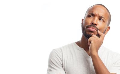 man holding jaw | dentist in bloomington indiana