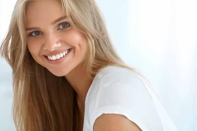 blonde woman smiling l dentist 47404