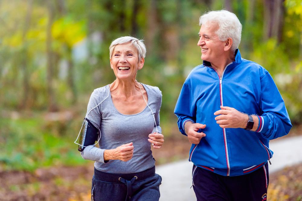 older couple running | cosmetic dentistry bloomington in