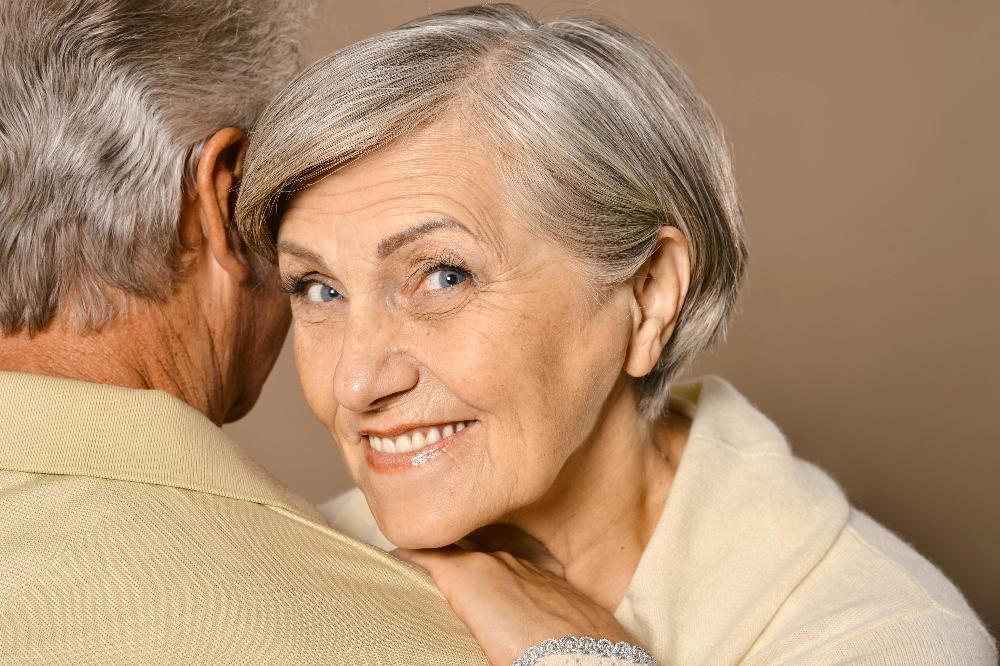 older woman smiling l dentist bloomington indiana