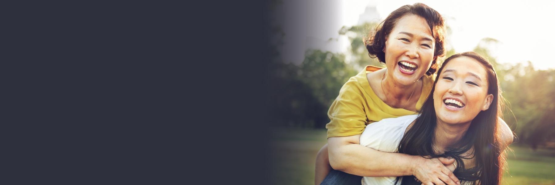 young asian woman with mother l bloomington dentist