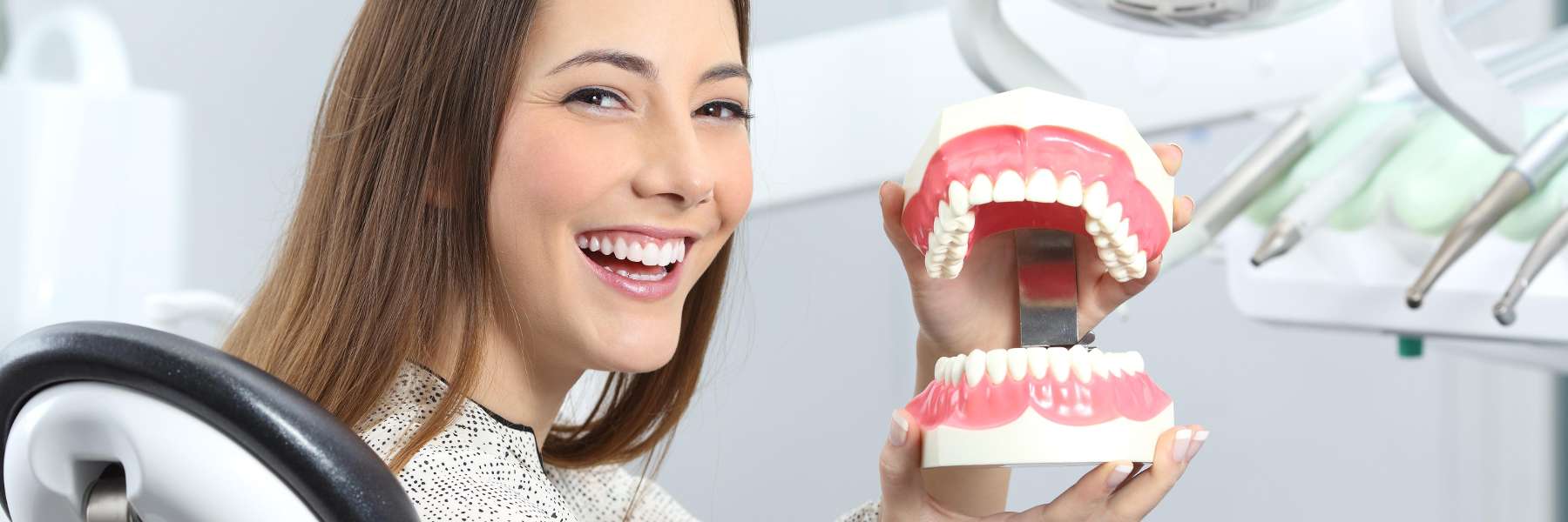 woman with brown hair smiling | cosmetic dentistry bloomington in