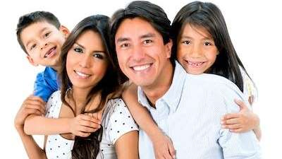 family of four smiling | dentist bloomington indiana