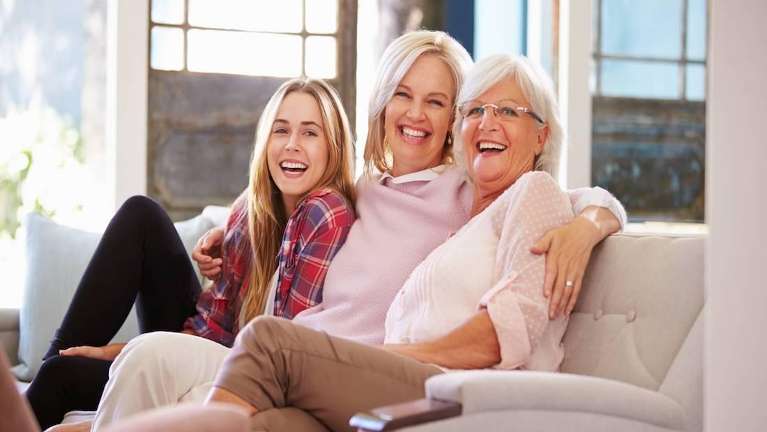 multi generation of women on couch | dentist near me