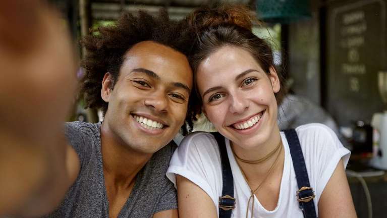 young couple hugging | dentist bloomington indiana