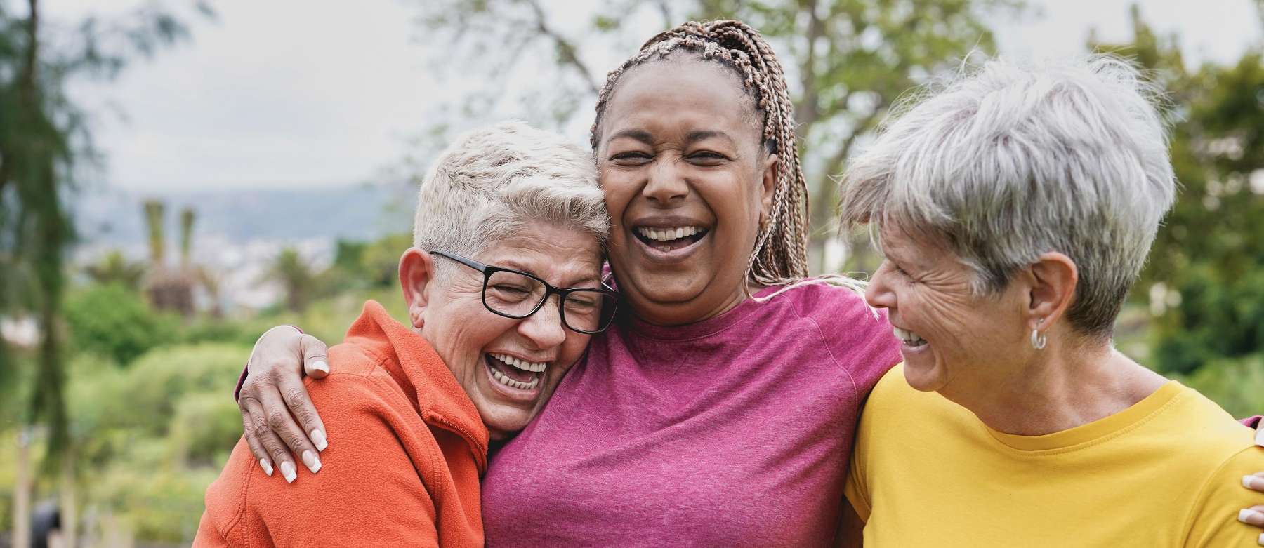 three older women hugging | dentist bloomington indiana