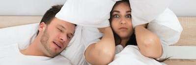 male snoring in bed | dentist bloomington in