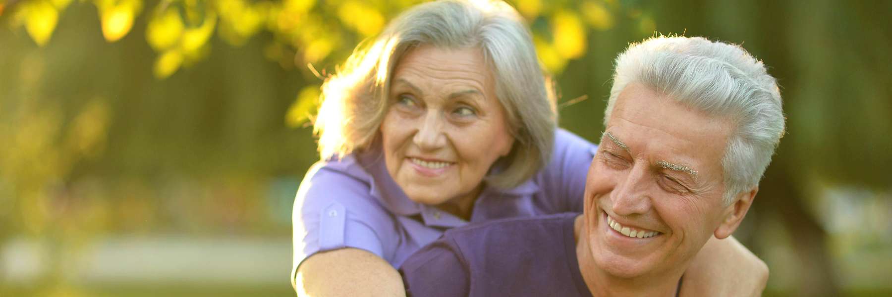 older couple smiling outside | dentist bloomington indiana