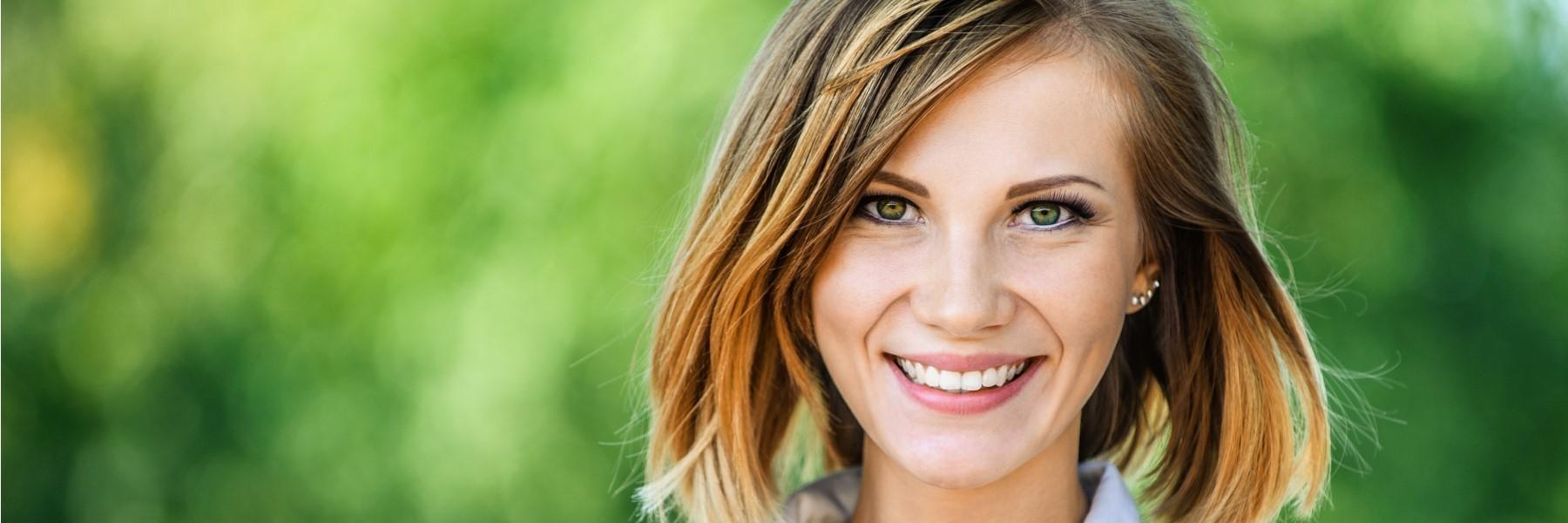 woman with brown hair smiling l bloomington cosmetic dentist