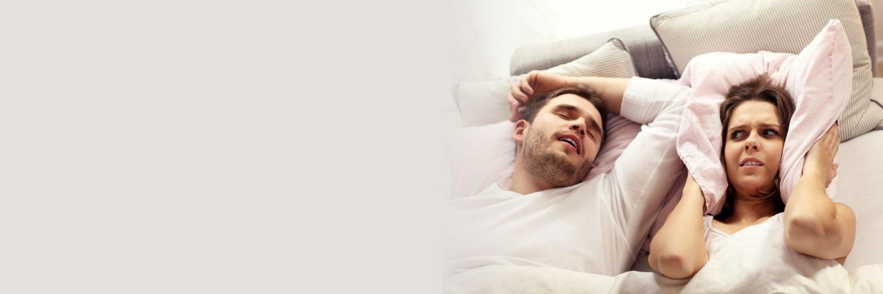 woman hearing partner snoring l sleep apnea dentist bloomington in
